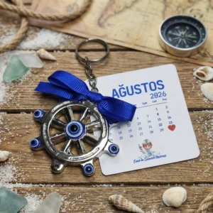 Emir in sünnet hatırası yazılı kart üzerinde mavi kurdeleli gümüş renk nazar boncuklu dümen anahtarlık